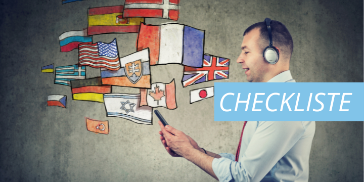 Symbolbild Checkliste Übersetzung, Mann mit Handy und Flaggen